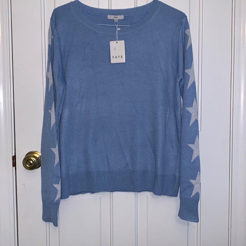 Light blue Fate sweater, with star sleeves. Large